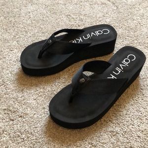 Brand new Black Calvin Klein wedge flip flops